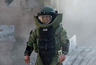 United States Navy Explosive Ordnance Disposal Technician suited up in a bomb suit