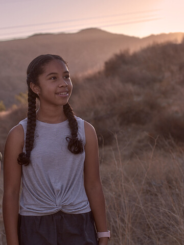 A high school student on a hike.