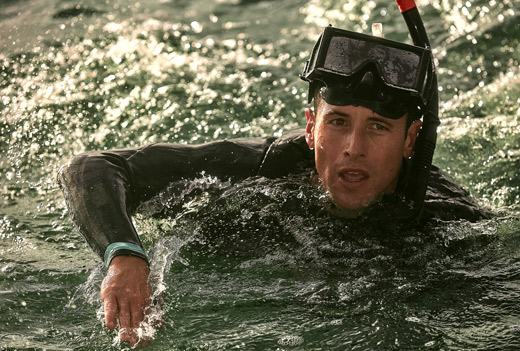 navy rescue swimmer training in the water