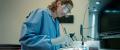 Navy Pathologist Heather Gaburo examines tissue in the lab at the Naval Medical Center in San Diego