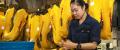 A United States Aircrew Survival Equipmentman stows a chem light in the survival pouch of a life preserver unit in the aviation survival equipment shop aboard the USS Kearsarge.