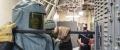 A United States Navy Electrician's Mate Nuclear manually charges a breaker aboard the USS Gerald R. Ford aircraft carrier.