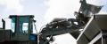 An Equipment Operator in the United States Navy operates a front-end loader on Naval Base Guam.