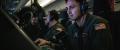 A United States Navy Aircrewman (Operator) tracks contacts at his workstation on a P-8A maritime patrol aircraft.