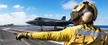 United States Navy Aviation Boatswain’s Mates inspect a launch catapult on an aircraft carrier. 